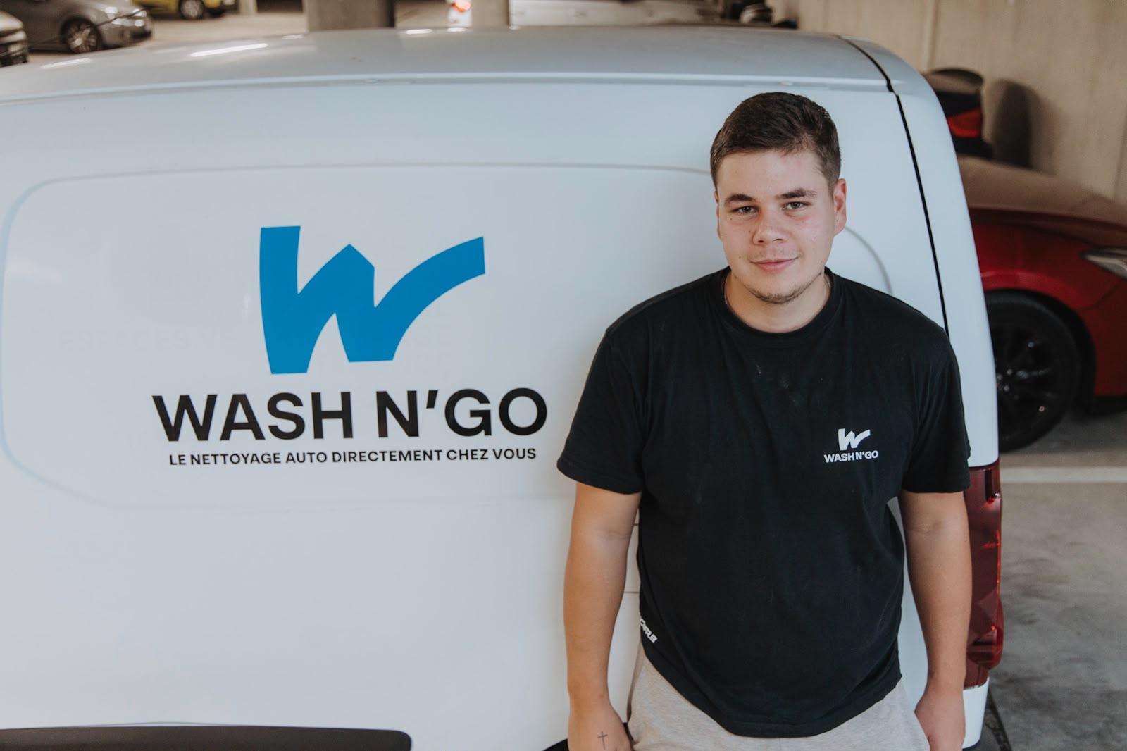The Wash N'Go team cleaning a car at the customer's home